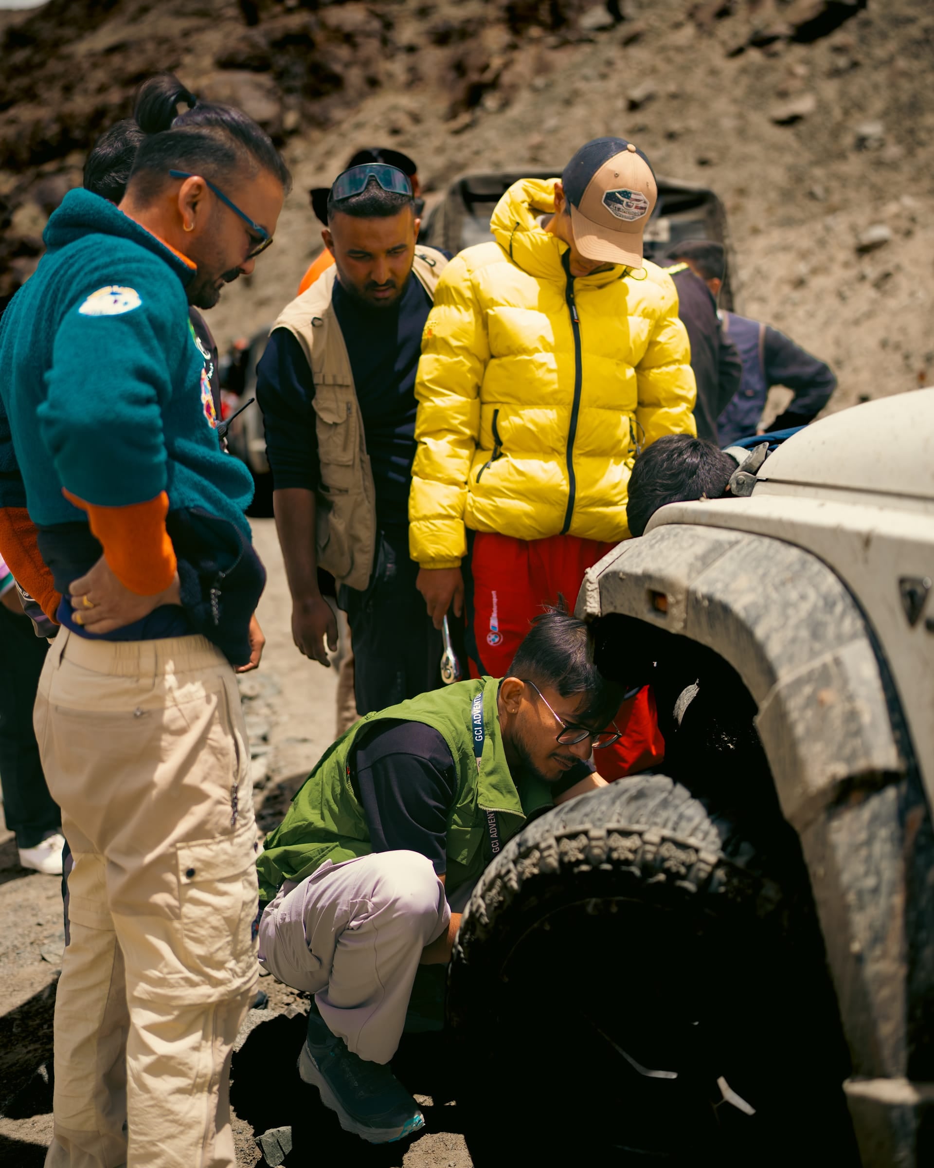 The GCI crew working on a tyre change on the trail